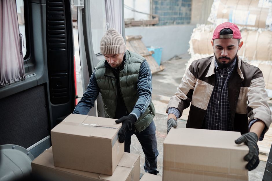 Team loading waste into a collection van